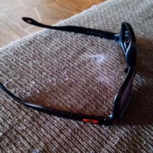 Oakley Black Sunglasses with Red Accent